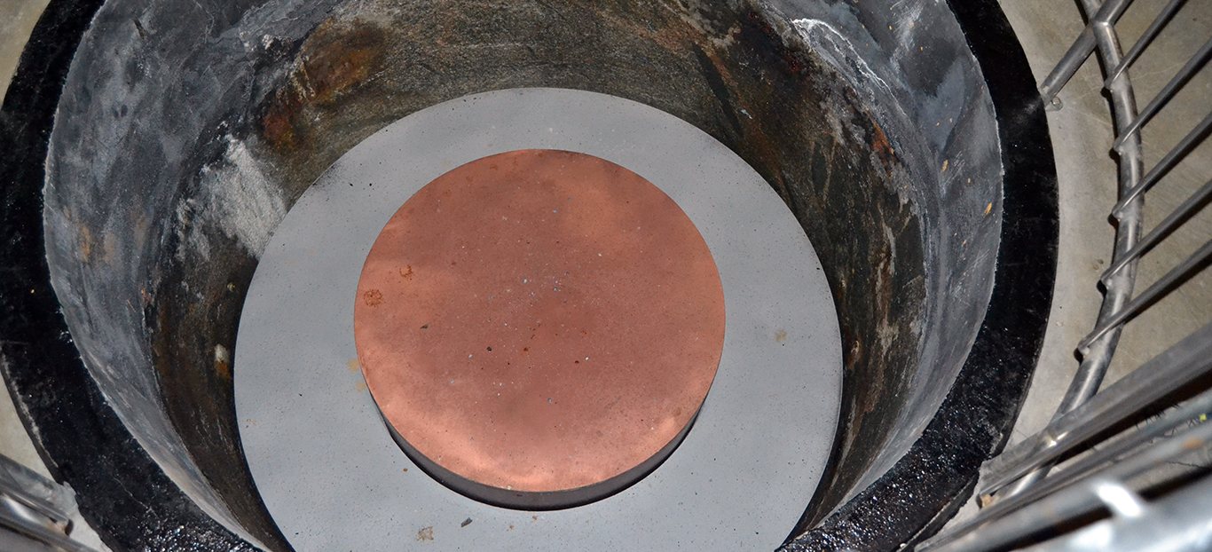 Associative image. Long-term nuclear waste storage copper cask submerged in bentonite clay © LEI