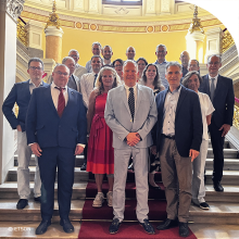 Members of General Assembly posing on a stage.